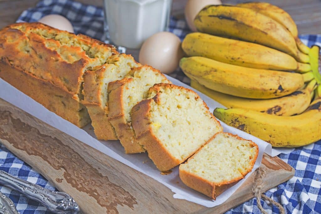 Sliced loaf of Hawaiian banana bread with pineapple and coconut.
