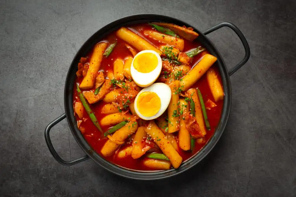 Chewy Korean rice cakes in spicy red chili sauce with vegetables