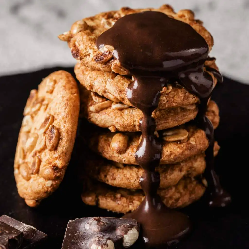 Close-up of soft, chewy cookies stacked on a plate.