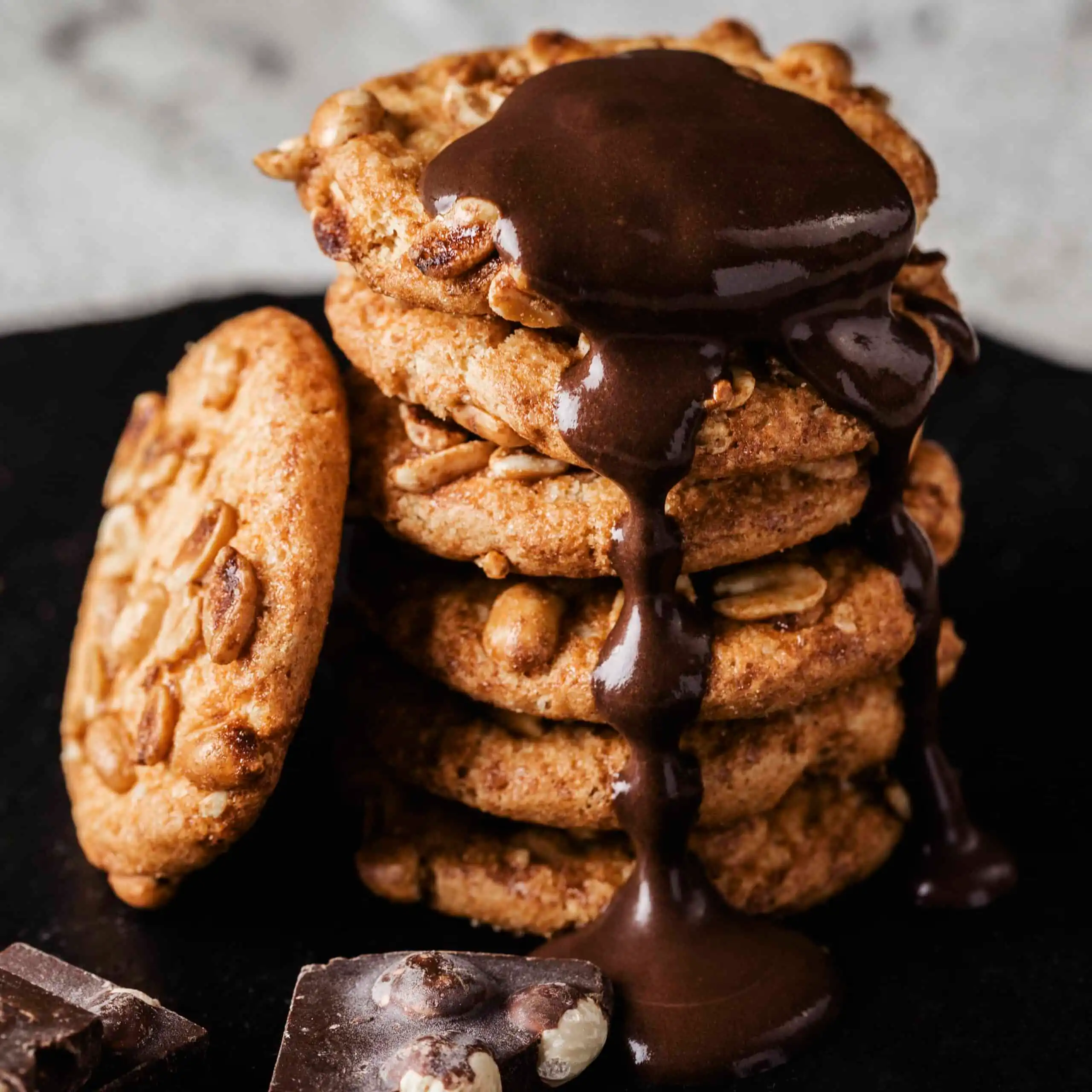 Close-up of soft, chewy cookies stacked on a plate.