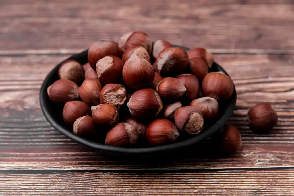 Image of freshly roasted chestnuts in a bowl, showcasing their rich, golden color and inviting aroma.