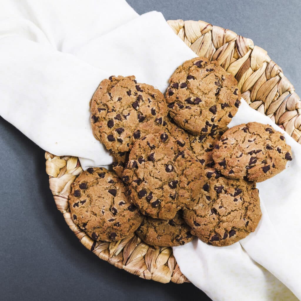 Freshly baked chocolate chip cookies without brown sugar on a cooling rack