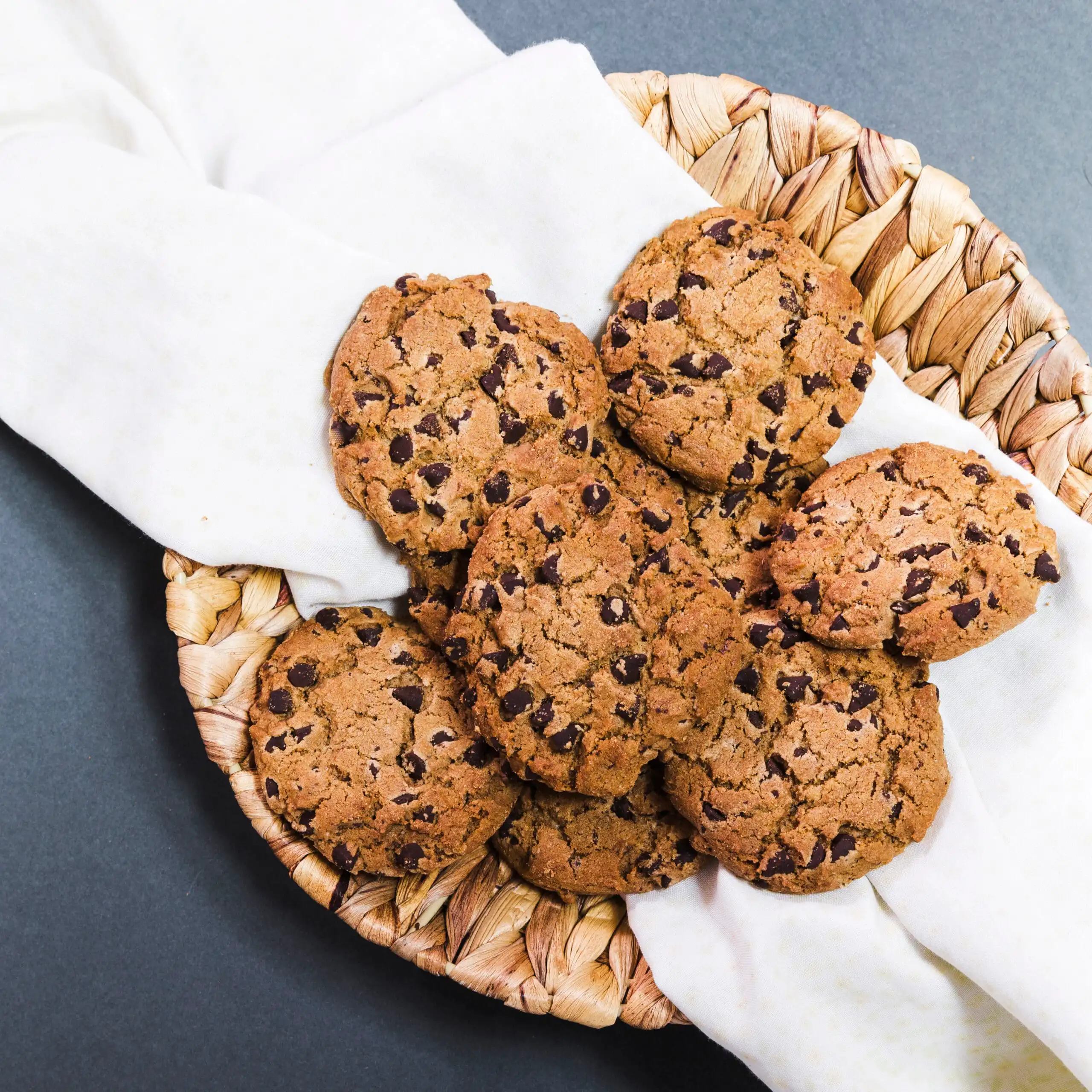 Freshly baked chocolate chip cookies without brown sugar on a cooling rack