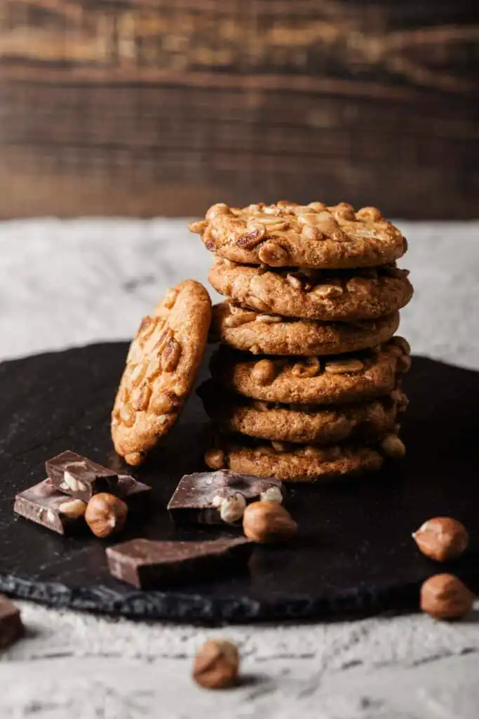 A plate of perfectly baked cookies with a golden-brown texture.