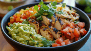 Juicy taco bowl with grilled chicken, vegetables, guacamole, and salsa